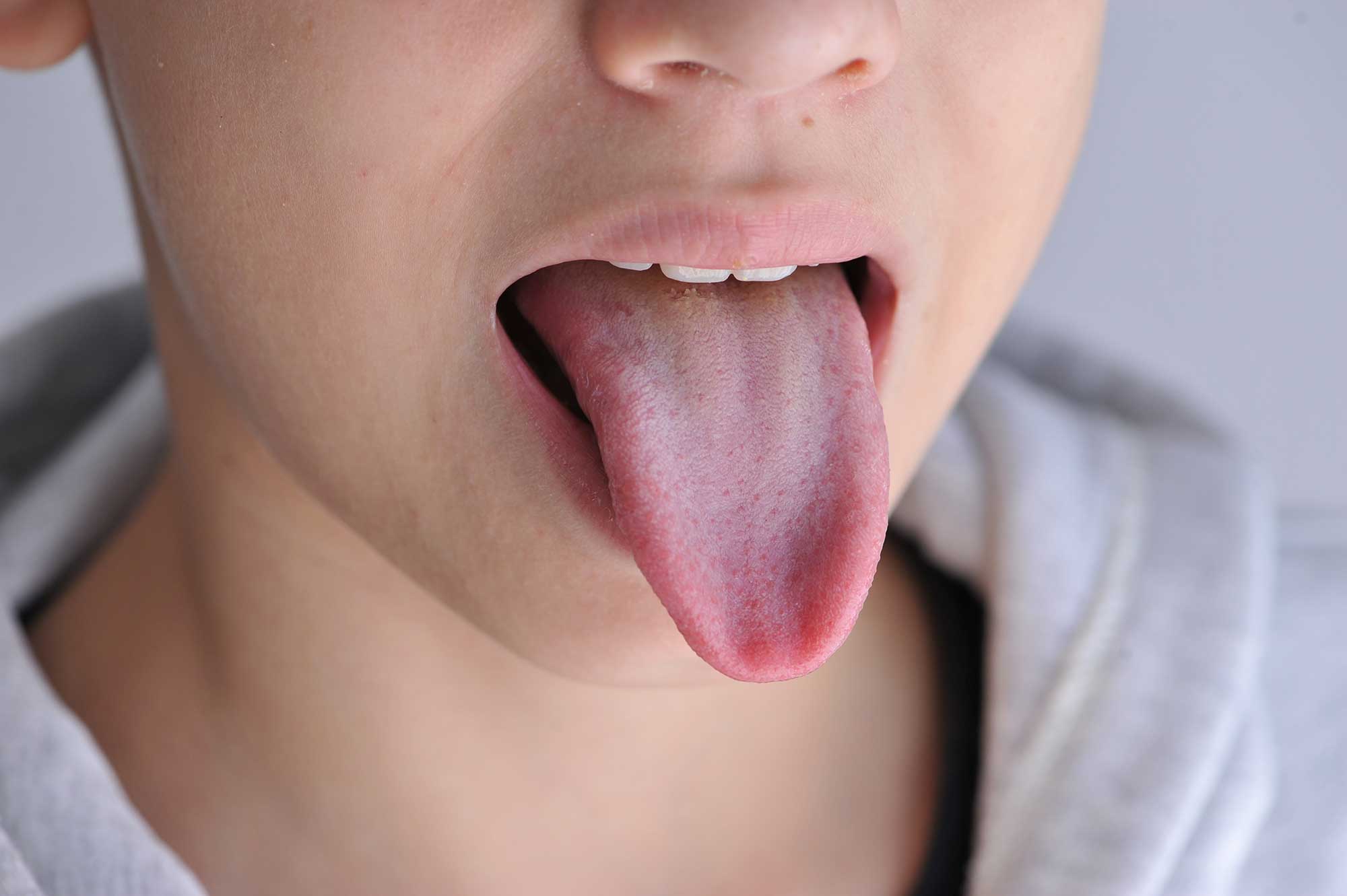 Close-up of person sticking their tongue out 