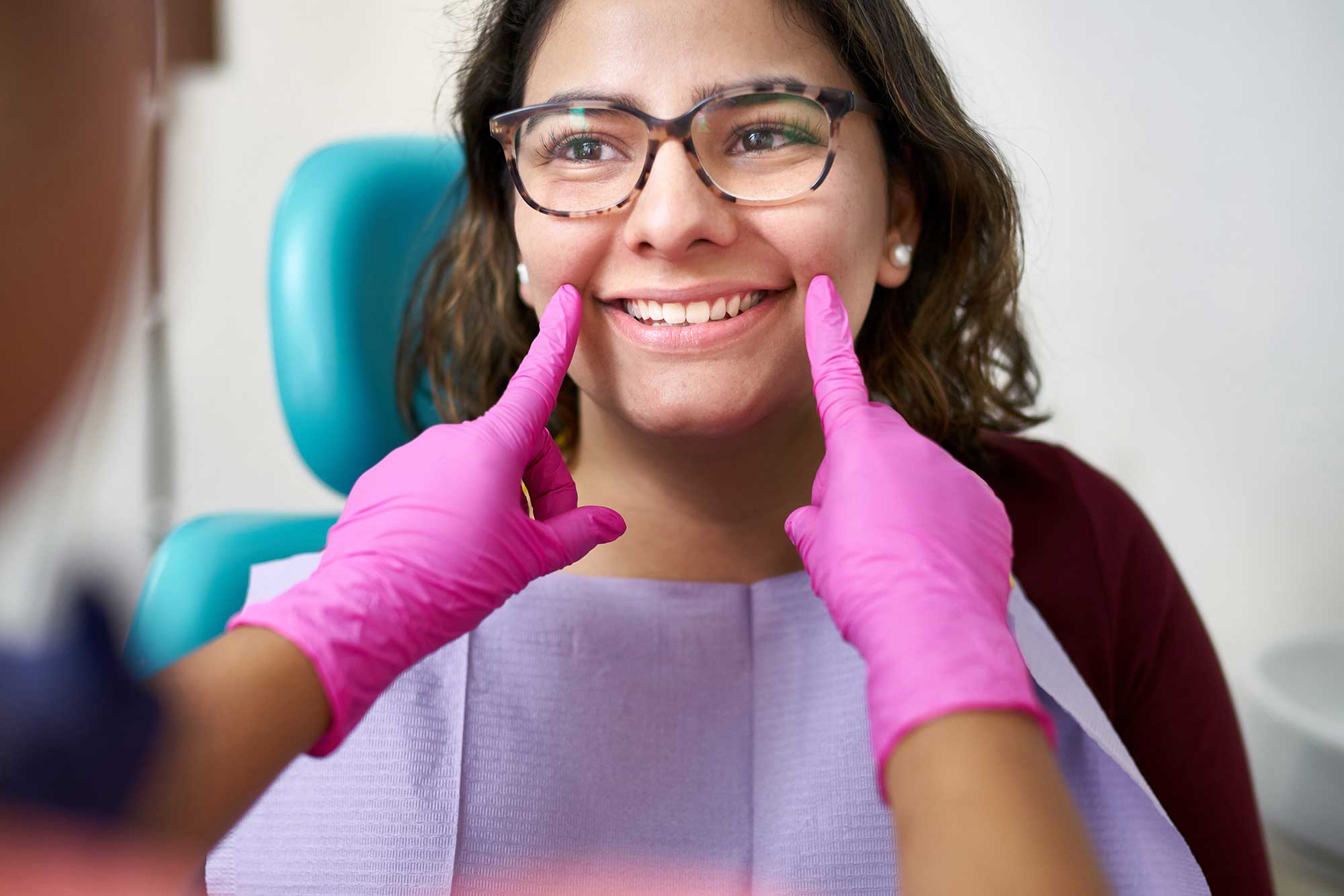 Smiling young patient waiting to get a dental exam