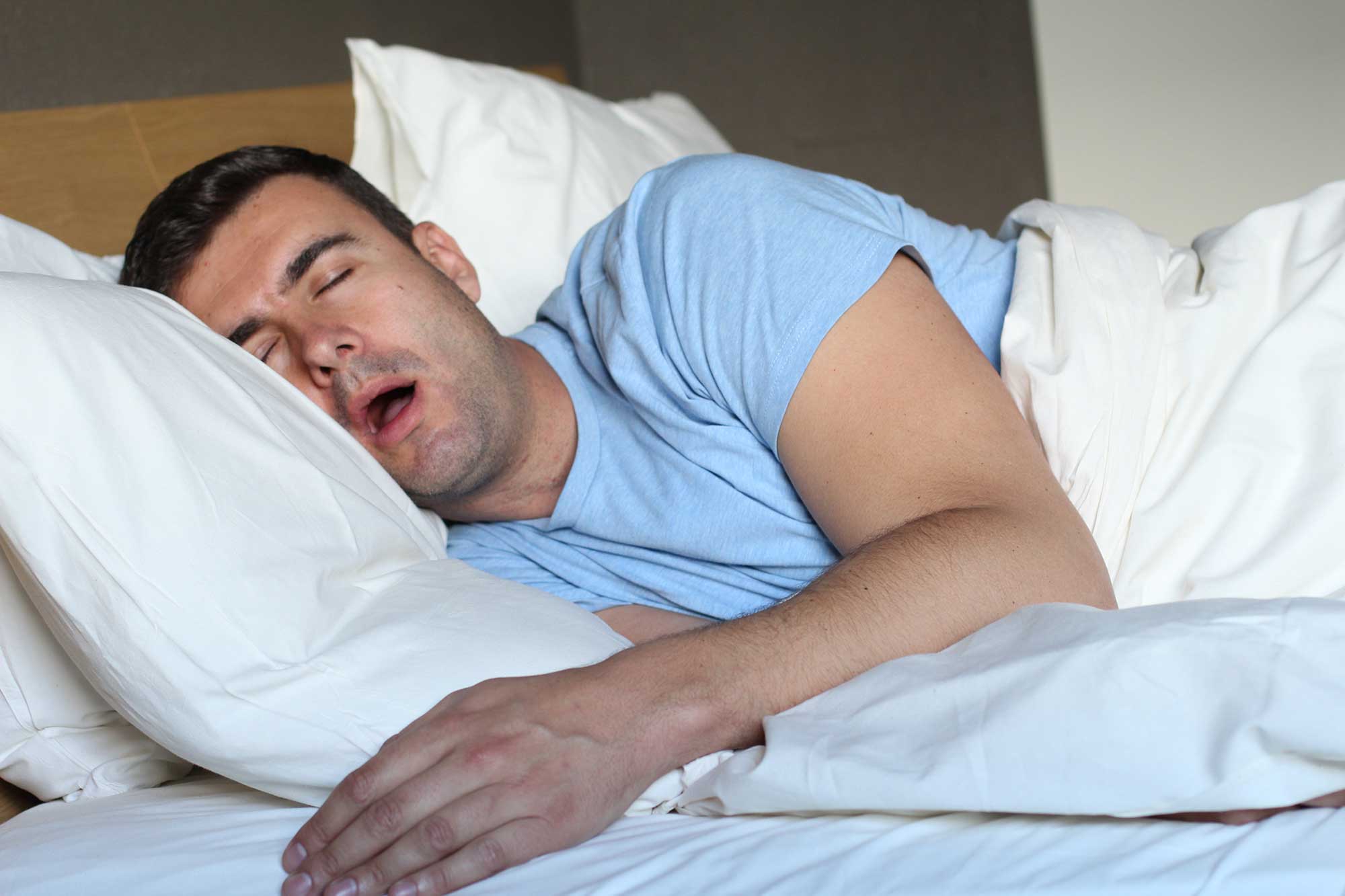 Man sleeping at night with his mouth open