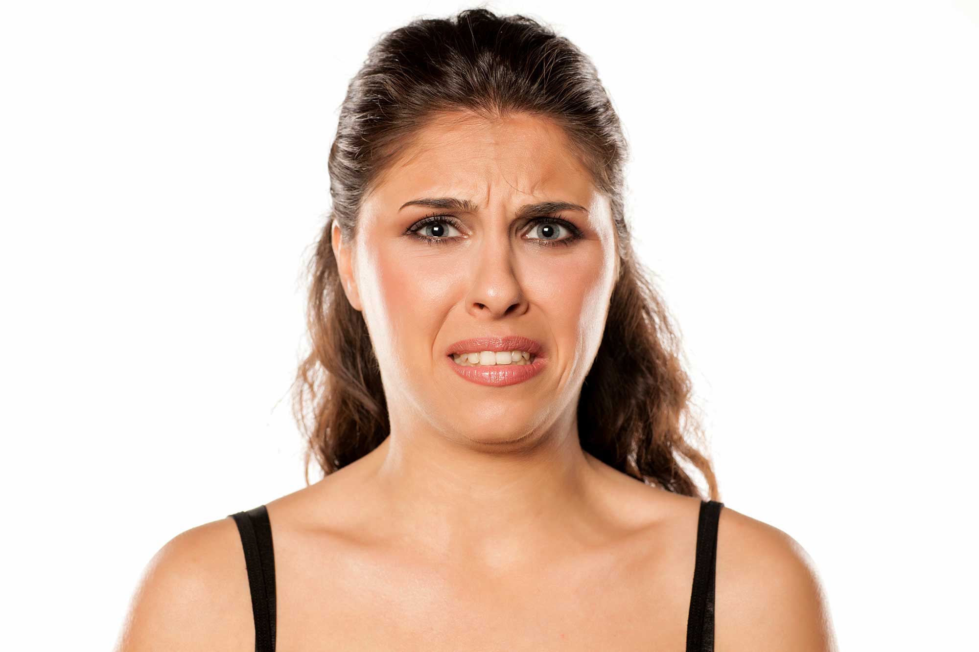 Woman grimacing due to a bad taste in her mouth Banner Image Woman grimacing due to a bad taste in her mouth