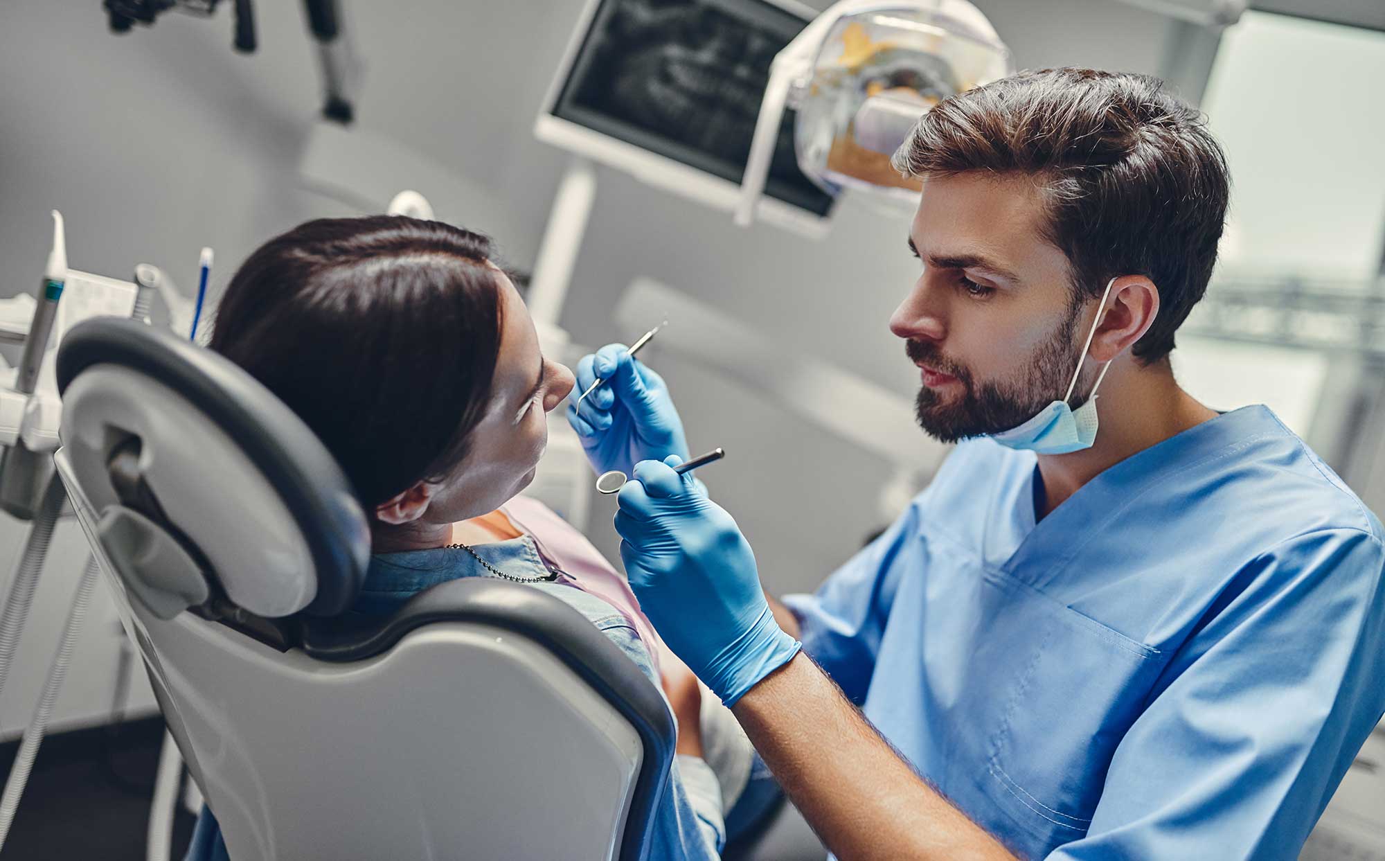 Woman patient getting their teeth examined in a dentist’s office image