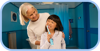 Kid with big smile showing clean teeth