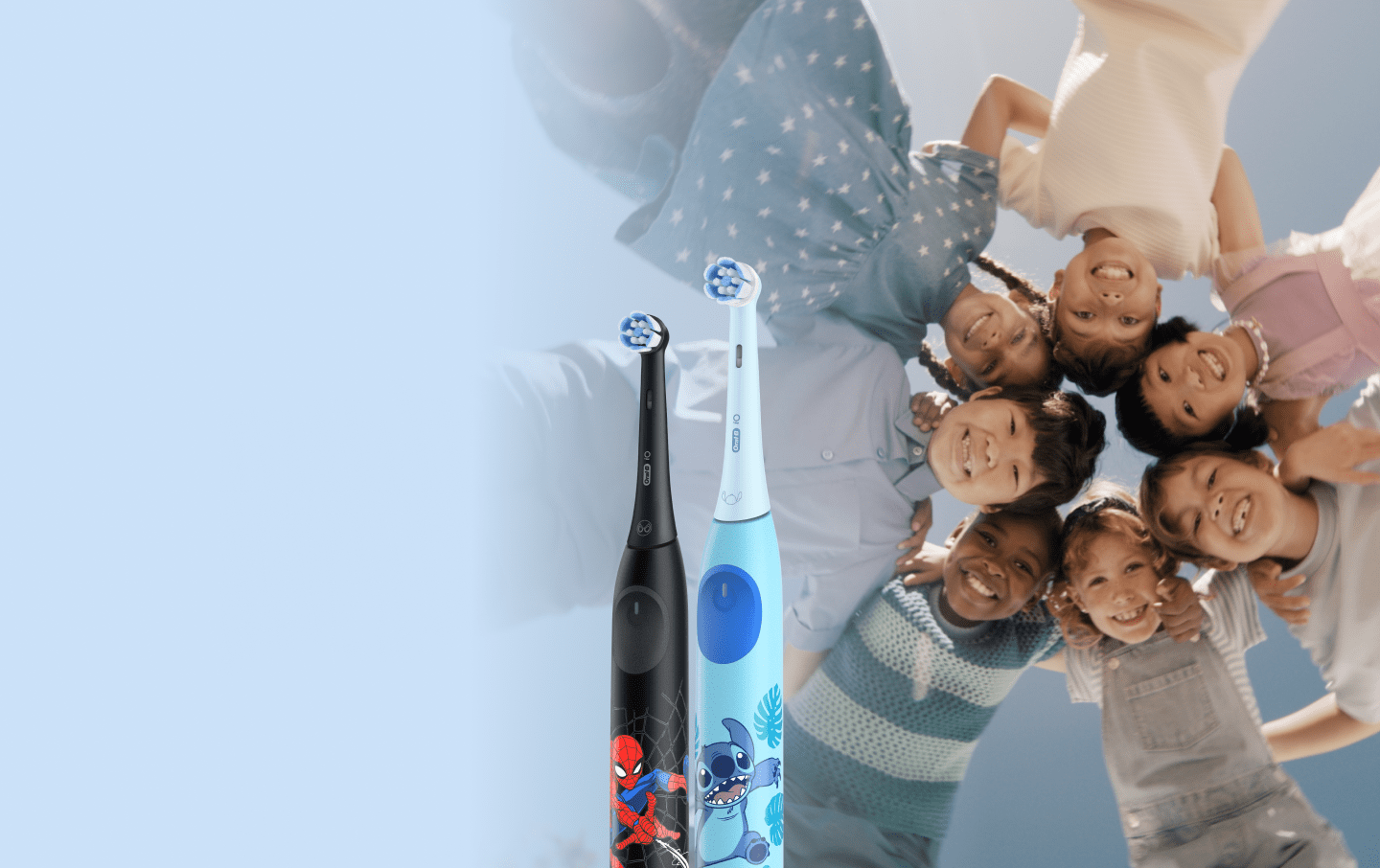 A family of four happily brushing their teeth together