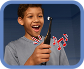 Kid holding electric toothbrush with music notes
