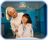 Kid with big smile showing clean teeth