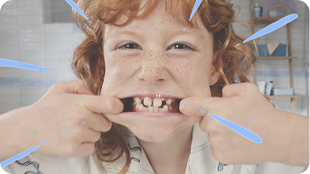 Redheaded girl smiling wide