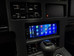 Aftermarket 1.5-DIN touchscreen radio mounted in a custom dash kit for a 1984–1989 Chevrolet Corvette (C4), displaying the Apple CarPlay home screen,