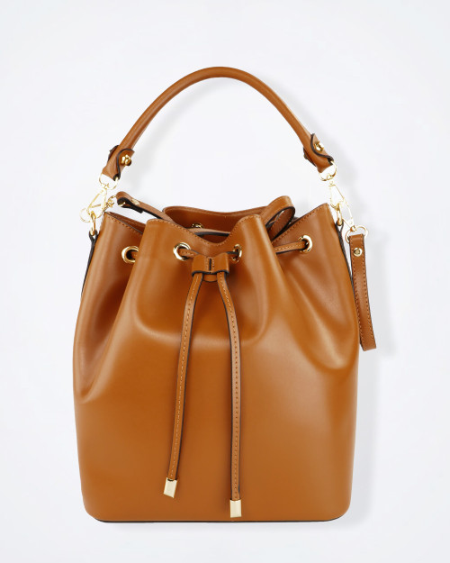 Italian‑made tan leather bucket bag with smooth finish and gold metal fittings.