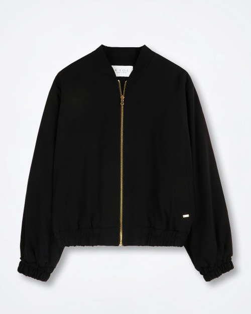KAOS black cropped wide‑sleeve jacket against a white background showing round neckline, snap‑button front, and wide structured sleeves.