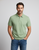 Male model wearing a Marselo light green cotton polo shirt