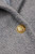 Close up of  button and texture texture on Sandro Ferrone coat