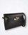 Detail shot of smooth black leather and polished gold fittings on Le Camp shoulder bag.