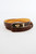 Detail shot showing croc‑embossed brown leather and gold metal buckle.