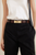 Model shot showing croc‑embossed brown leather and gold metal buckle.