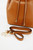 Detail shot of smooth tan leather with gold metal fittings on Le Camp bucket bag.