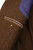 Interior view of the Camicissima men’s herringbone blazer, showing the partial lining, inner pockets, and construction details.