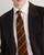 Model of the Pal Zileri silk tie’s diagonal pattern, showing the fine weave and subtle tonal contrast.