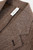 Marselo blazer lapel and collar in brown herringbone fabric with visible “Made in Italy” label and brown lining.