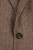 Close‑up of Marselo blazer’s brown herringbone fabric showing tortoiseshell button and fine check weave detail.