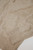 Close‑up of beige cashmere‑blend knit showing ribbed cuff, hem, and pocket texture highlighting the soft, premium weave.