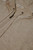 Detailed view of Camicissima cashmere‑blend hoodie neckline showing metal eyelets, drawstring, and branded label near the zipper.