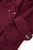 Detailed shot of the bouclé fabric revealing its soft, looped texture and rich surface depth.