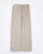 Beige loose‑fit pants by Maryley laid flat against a white background, showing straight‑leg cut, elastic waistband, and drawstring ties.