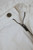 Close‑up of denim texture, stitching, or branding on the Emporio Armani white jeans.