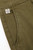 Close‑up of the Block 11 chino’s green stretch cotton fabric, waistband, and pocket detailing.