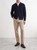 Model wearing Why Not Brand men’s zip‑up cardigan, demonstrating fit and styling.