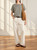 Model wearing Le Streghe striped jersey top, demonstrating fit and styling.