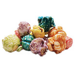 A mix of six pastel-colored fruit-flavored popcorns.