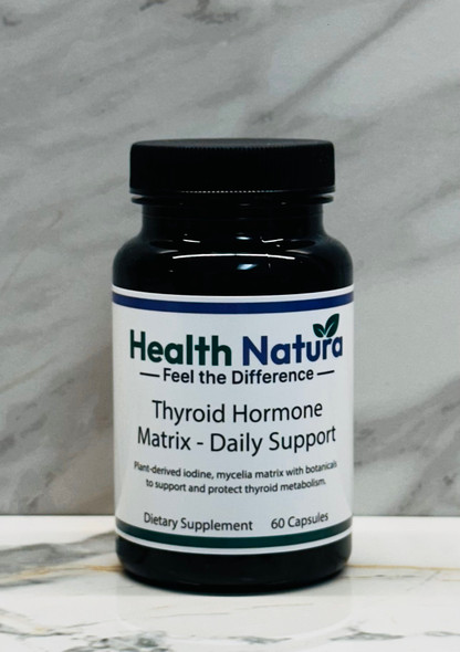 Thyroid Hormone Matrix Daily Support supplement bottle with plant-derived iodine on marble background.