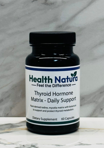 Thyroid Hormone Matrix Daily Support supplement bottle with plant-derived iodine on marble background.