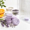 Homemade lavender shower steamer beside dried lavender