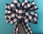 This Holiday bow will add style to any Christmas arrangement.