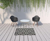 4' X 6' Black Geometric Stain Resistant Indoor Outdoor Area Rug