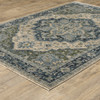 6' X 9' Blue Grey Beige Tan Green And Gold Oriental Power Loom Stain Resistant Area Rug With Fringe