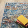 10' X 13' Blue Teal Gold Rust And Beige Abstract Power Loom Stain Resistant Area Rug