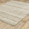 9' X 12' Ivory Grey Tan And Brown Abstract Power Loom Stain Resistant Area Rug
