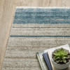 4' X 6' Blue Dark Blue Teal Grey Ivory Beige And Tan Geometric Power Loom Stain Resistant Area Rug With Fringe