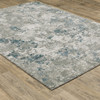 9' X 12' Blue Beige And Teal Abstract Power Loom Stain Resistant Area Rug