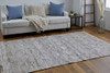 5' X 8' Tan Gray And Ivory Geometric Hand Woven Stain Resistant Area Rug With Fringe
