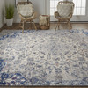 9' X 12' Ivory Gray And Blue Floral Power Loom Distressed Stain Resistant Area Rug