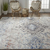 9' X 12' Ivory Taupe And Blue Floral Power Loom Distressed Stain Resistant Area Rug