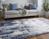 10' X 13' Tan Blue And Ivory Abstract Power Loom Distressed Area Rug