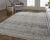 10' X 13' Tan Ivory And Blue Geometric Power Loom Distressed Area Rug With Fringe