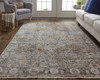 10' X 13' Tan Orange And Blue Floral Power Loom Distressed Area Rug With Fringe