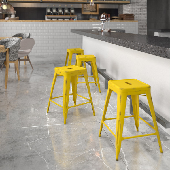 Kai Commercial Grade 24" High Backless Distressed Yellow Metal Indoor-Outdoor Counter Height Stool