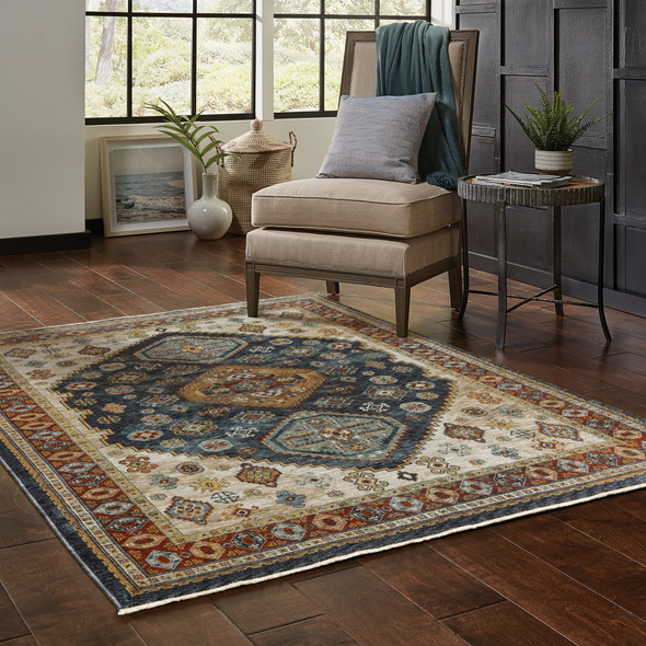 6' X 9' Blue Red Beige Orange Gold And Tan Oriental Power Loom Stain Resistant Area Rug With Fringe